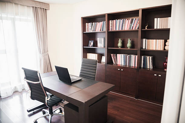 istock Modern home office with bookshelves. 458813187