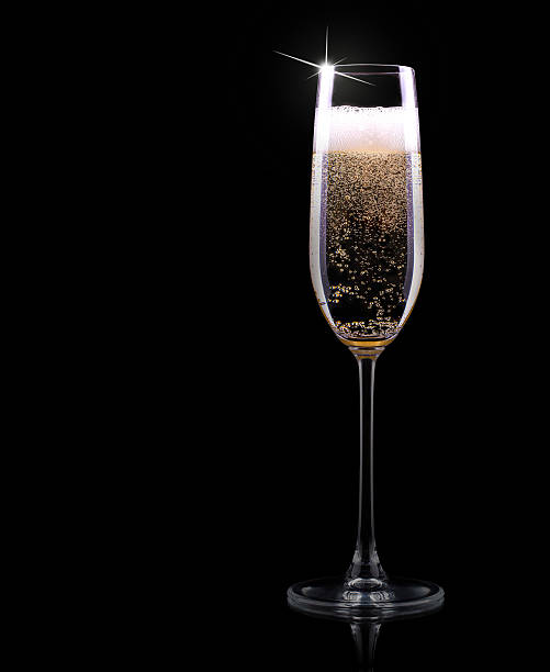 istock champagne glass on black background 458824167