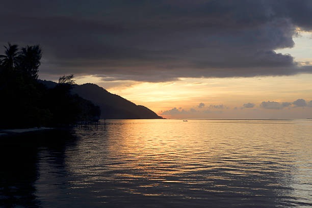 istock Sunset and cloudy sky Raja Ampat islands 458839823