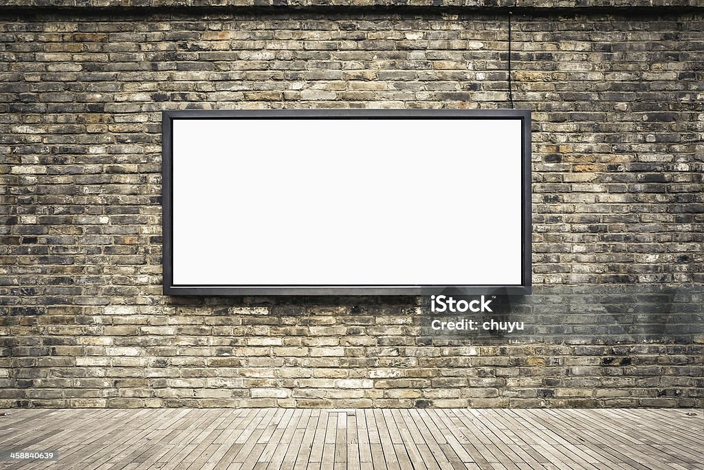 blank billboard on old brick wall blank advertising light box in the old brick wall for your advertisement Advertisement Stock Photo