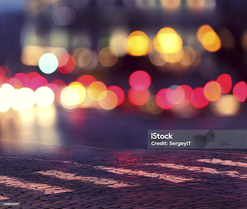 night lights in city and zebra crossing night lights in city and zebra crossing on pavement Abstract Stock Photo
