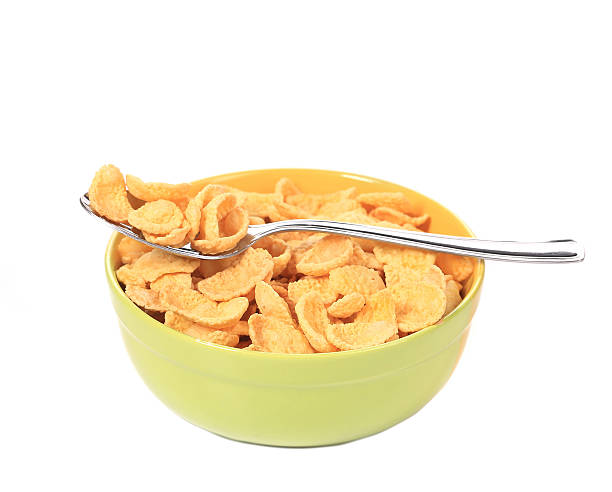 istock Bowl of sugar-coated corn flakes and spoon. 458843849