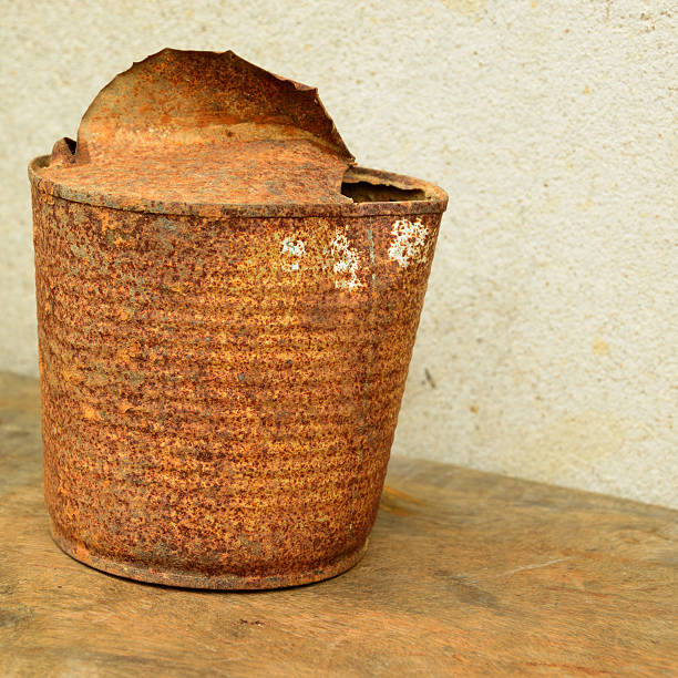 istock old rusty tin can on wood floor 458844387
