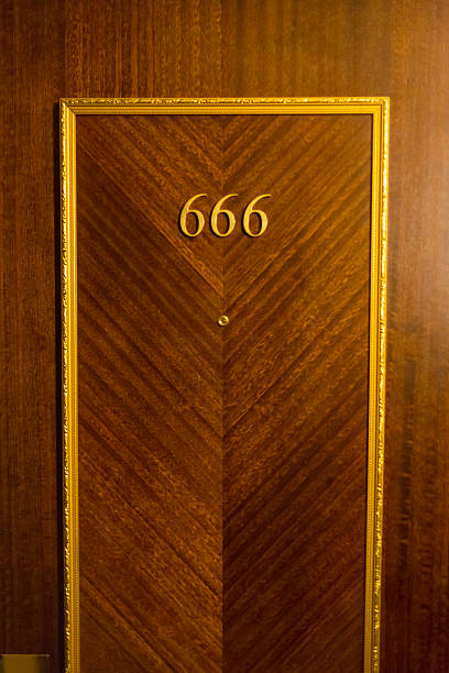 istock Haunted hotel room door 458848289