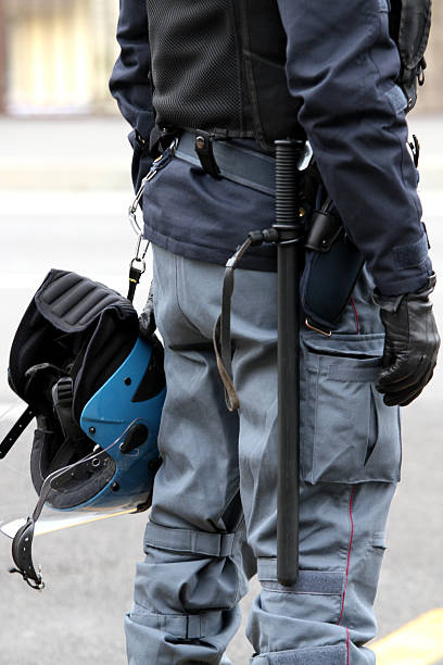 istock policeman with truncheon, helmet gun and handcuffs 458852013