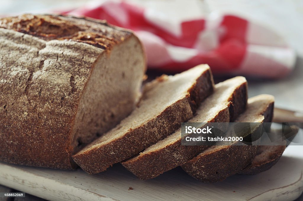 Sliced rye bread Sliced rye bread on cutting board closeup Baked Stock Photo