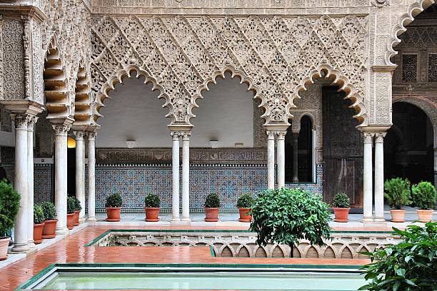 Alcazar of Seville Seville, Spain - Alcazar Palace, famous UNESCO World Heritage Site. Moorish architecture. alcazar seville stock pictures, royalty-free photos & images
