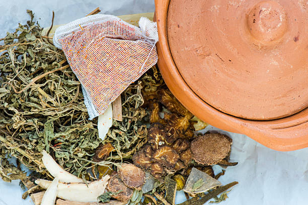 istock Clay pots and chinese medicine for boiling 458854427