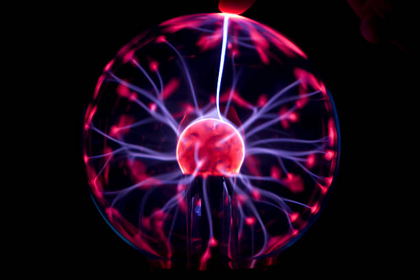 istock Plasma ball casting beam to a finger 458858197