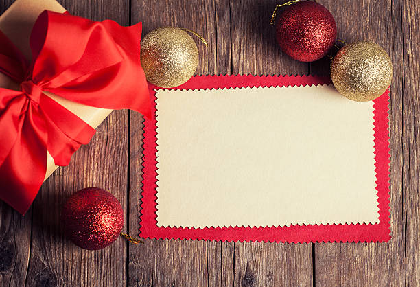 istock sheet of paper with gift box on wooden background 458859367