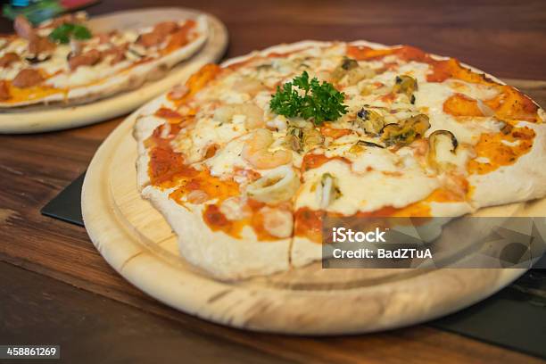 Seafood Pizza Produces From Wood Fired Oven Stock Photo - Download Image Now - Animal Shell, Baked, Basil