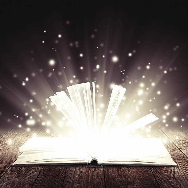 istock open book with light insideout on wooden background 458862891