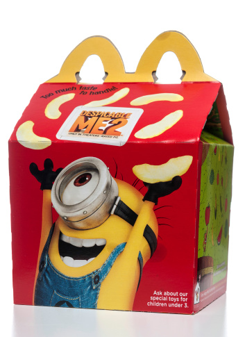 Miami, USA - July 20, 2013: McDonald's Happy Meal box with Despicable Me2 promo. McDonald's Corporation is the world's largest fast food chain.