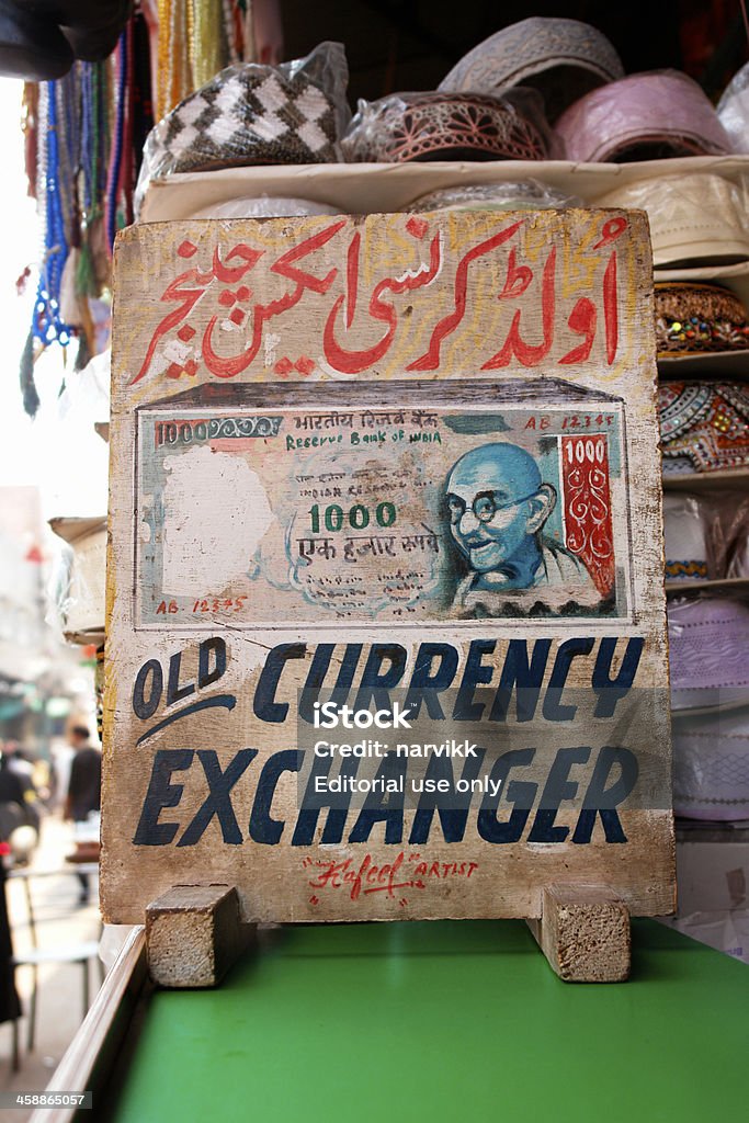 Currency exchanger banner in India Delhi, India - October, 11th 2007: Hand painted advertisement announcing money exchange on the market in central Delhi Advertisement Stock Photo