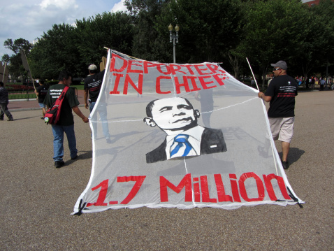 Washington DC, USA-July 24, 2013:  These protesters march in front of the White House in Washington DC to ask president Barack Obama to stop deporting latinos.  Under his administration 1.7 million latinos have been deported-more than any other president.