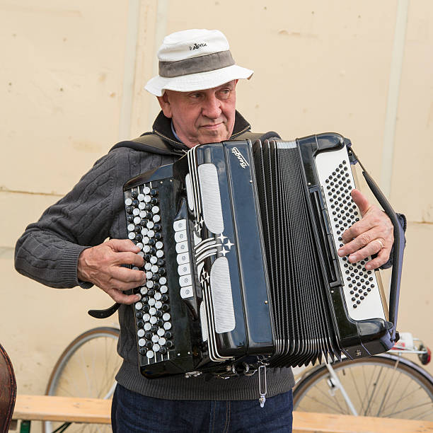 senior playing old accordion. - dragspel ute sverige bildbanksfoton och bilder