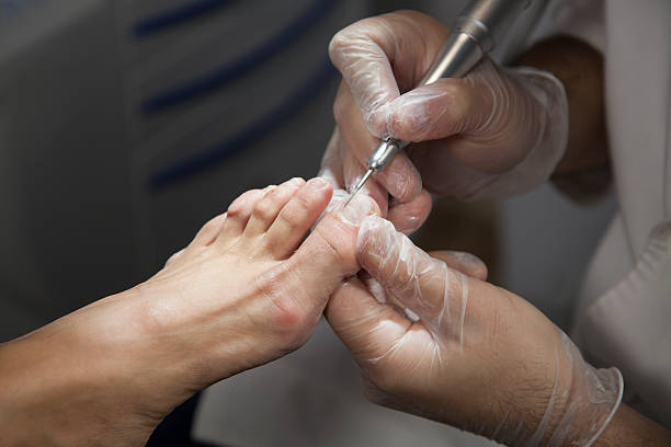 istock Podiatrist checking a person's toes and feet 458866229