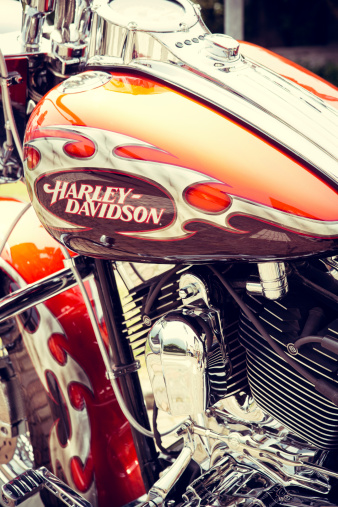 ForlA, Italy - July 13, 2013: Detail of Harley Davidson logo in a tank of motorcycle. Harley Davidson is an American motorcycle manufacturer founded in Milwaukee ,Wisconsin USA. No people