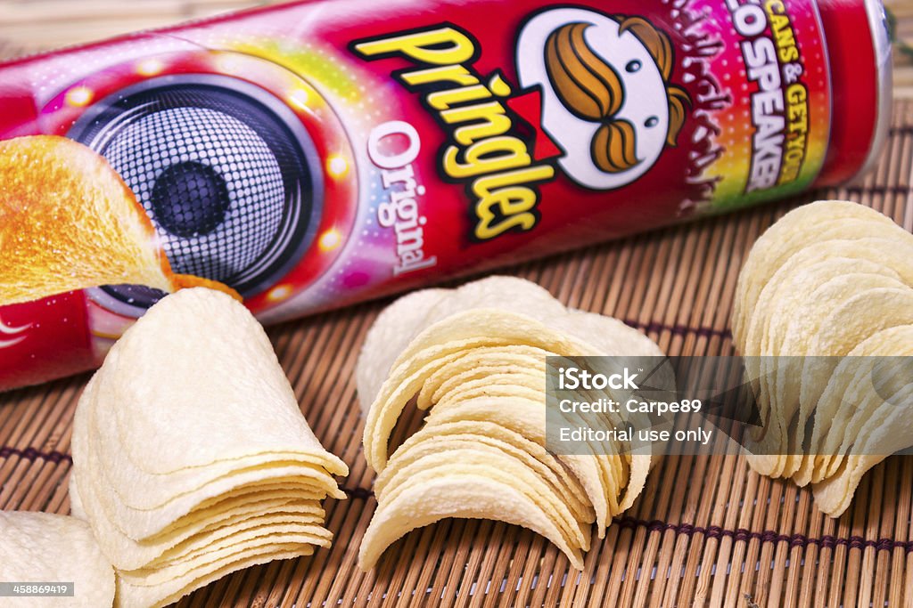 Pringles, delicious chips Milan, Italy - August 28, 2013: Pringles potato chips in front of snack size Pringles can. Pringles was invented by Procter and Gamble but in April Procter and Gamble agreed to sell the Pringles brand to Diamond Foods of California. Potato Chip Stock Photo