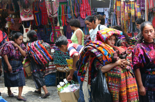 Chichicastenango, Guatemala - May 14, 2007:  Street Stalls line the village of Chichicastenango three days a week as the locals purchase and sell mostly handcrafted goods.
