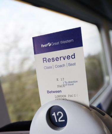 Oxford, United Kingdom - March 18, 2013: First Great Western seat reservation for a journey from London Paddington to Oxford. First Great Western is an English railway company providing services between London and the West of England/Wales. The train this reservation is for is one serving the Cotswold Line to Worcester and Hereford.