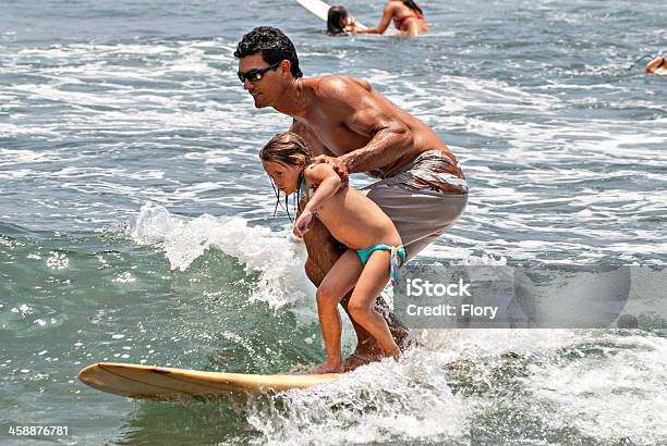 Father And Daughter Surfers Stock Photo - Download Image Now - Active Lifestyle, Adult, Aquatic Sport