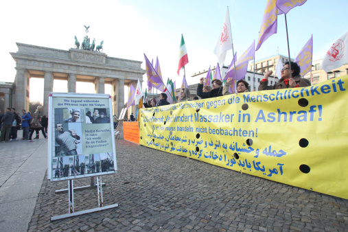 Berlin, Germany - November 3, 2011: Iranian demonstrators in front of US embassy on Parizer Platz on November 3, 2011 in Berlin, Germany. Protesters want the US to protect Irani refugees inside Ashraf Camp, Iraq.