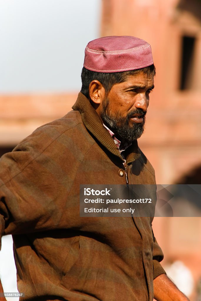 Man in street Delhi, India - February 11, 2008: Bearded middle aged muslim wearing Taqiyah at Jama Masjid on February 11, 2008 in Delhi, India. This mosque is the largest and most frequented in India. Islam Stock Photo