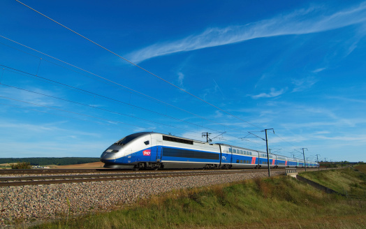 Sens, France - 19 September 2010: A french high speed train passing through a field.