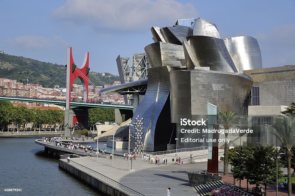 Guggemheim Museum in Bilbao, Spain Bilbao, Spain - July 30, 2011: Famous Guggenheim Museum of modern and contemporary art designed by architect Frank Gehry. Various tourists walking by the museum. Bilbao Stock Photo