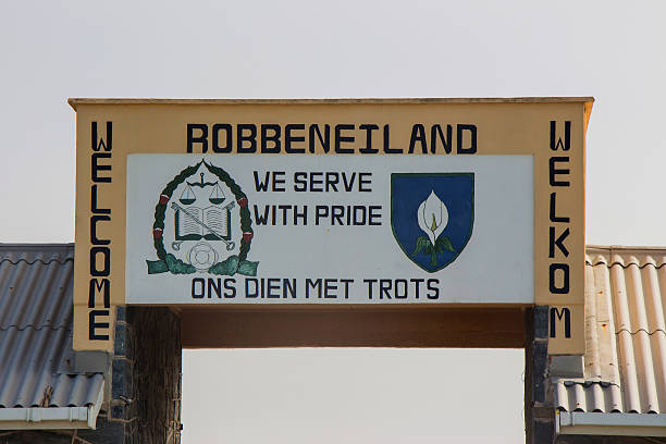 Robben Island Welcome Sign 2 Cape Town, South Africa - May 2, 2013: A close up of the sign at the entrance to Robben Island. apartheid sign stock pictures, royalty-free photos & images