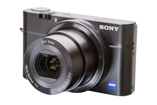 Tambov, Russia, February 28, 2013:  Sony, Zeiss-branded 28-100mm equivalent F1.8-4.9 stabilized lens featuring Zeiss T* coatings to minimize internal reflection on the Sony Cyber-shot DSC-RX100