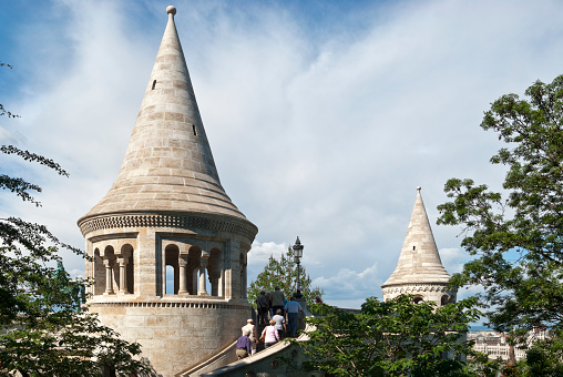 Budapest, Hungary - May 28, 2012: Fisherman Bastion on the Buda Castle hill, there are visible various people, on May  28, 2012 in Budapest, Hungary.The fishing bastion is a part of the Budaysky fortress, more precisely, its fortification. The bastion was constructed by the architect Frideshom Shuleky between 1895-1902gg on a place of the old, partially collapsed walls of a fortress