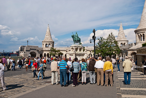 Budapest, Hungary- May 28, 2012: Fisherman Bastion on the Buda Castle hill, there are visible various people, on May 28, 2012 in Budapest, Hungary.The fishing bastion is a part of the Budaysky fortress, more precisely, its fortification. The bastion was constructed by the architect Frideshom Shuleky between 1895-1902  on a place of the old, partially collapsed walls of a fortress