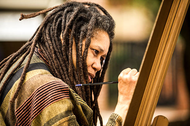 Raleigh, North Carolina, USA - October 10, 2012: Local artist, Linda Dallas, paints for the opening of the Gregg Museum of Art and Design at North Carolina State University.