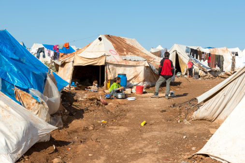 Atmeh, Syria - January 14, 2013: Syrian children live at the camp for displaced persons outside the town of Atmeh in Idlib Province. They and their families have been driven from their homes by the ongoing civil war in Syria.