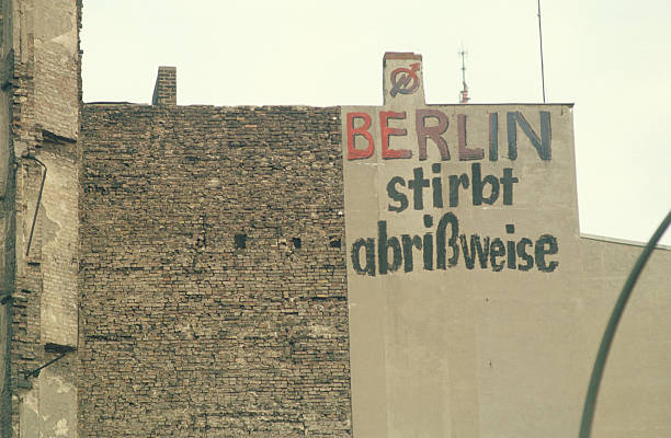 Berlin, Germany - April 24, 2011: East Side Gallery wall of Berlin Germany. Graffiti painting on the Berlin wall that are part of the East Side Gallery,it is a long section of the original Berlin wall that has been transformed in a freedom memorial. Around 100 artists from all over the world painted in 1990 this section of the wall. The paintings are now restored after they suffered badly from vandalism that damaged badly the original ones.