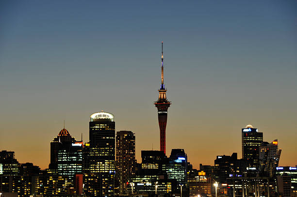 Auckland, New Zealand, January 24, 2012: A cityscape view of the central area of Auckland City at dusk, as seen across the harbour from Devonport. This shows Auckland \