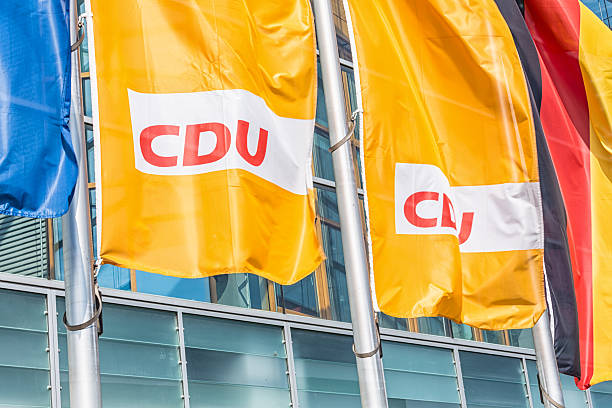 Flags in front of the CDU headquarters (Berlin) Berlin, Germany - August 06, 2013: Flags in front of the CDU headquarters in Berlin. CDU is one of two great traditional parties in Germany. The address is KlingelhAferstrae 8, 10785 Berlin. christian democratic union photos stock pictures, royalty-free photos & images