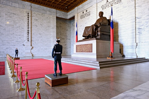 Taipei, Taiwan - January 16, 2013: Soldiers stand guard at Chiang-kai-shek Memorial Hall. Chang Kai-shek  ruled mainland China for 22 years, and Taiwan for 30 years.