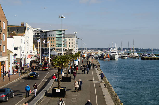 Pedestrians on Quayside, Poole Harbour stock photo