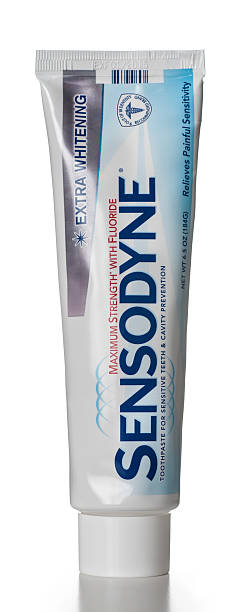 Sensodyne Extra Whitening toothpaste tube Miami, USA - August 02, 2013: Sensodyne Extra Whitening toothpaste 6.5 OZ tube. Sensodyne brand is owned by GlaxoSmithKline. relieves stock pictures, royalty-free photos & images