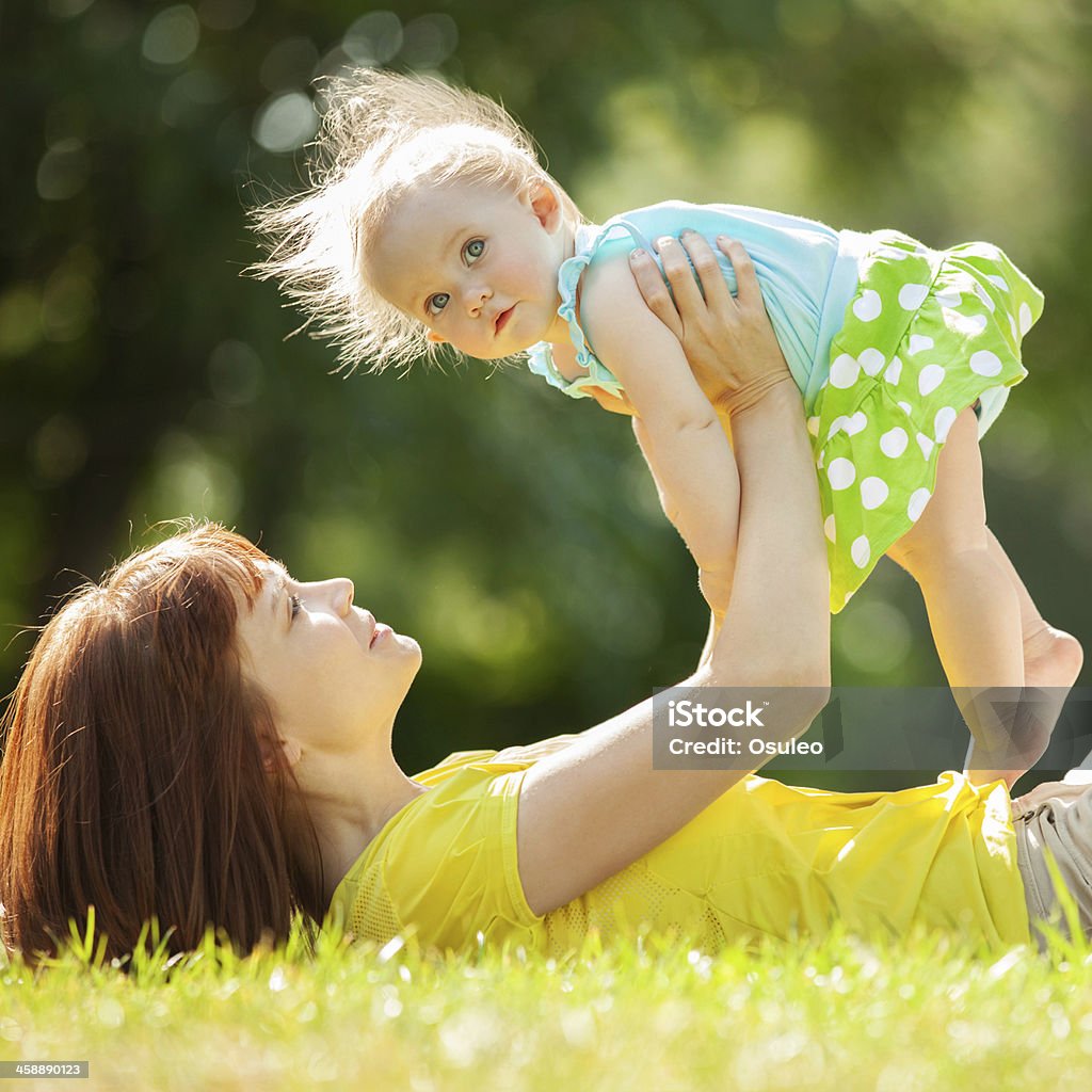 Happy mother and daughter in the park Adult Stock Photo