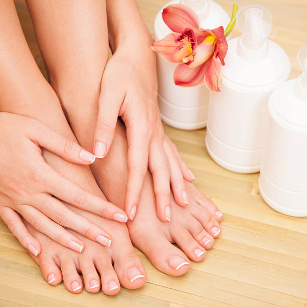 istock A pair of hands resting on a pair of feet 458890589
