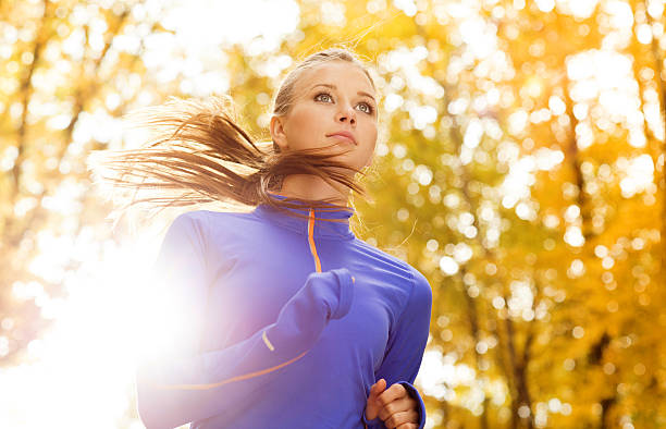 A female runner outside in autumn