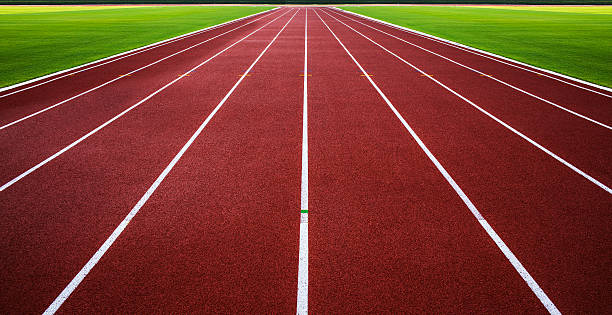 New running track with green grass abstract, texture, background. stock photo