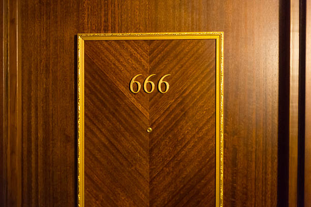 istock Haunted hotel room door 458900047