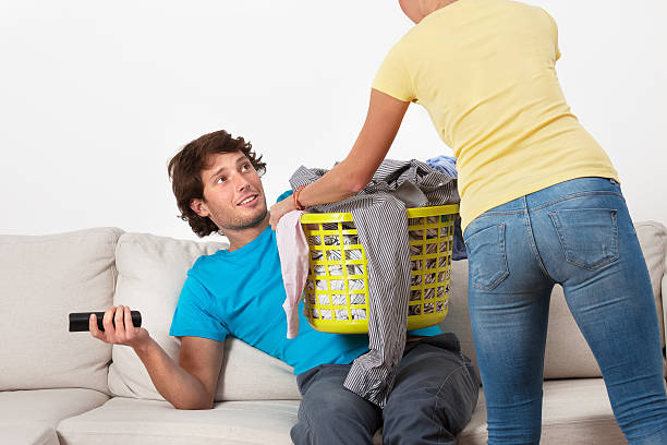istock Couch potato and his wife 458900067