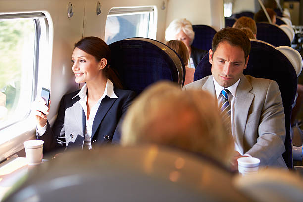 istock Businesswoman Commuting To Work On Train Using Mobile Phone 458904819
