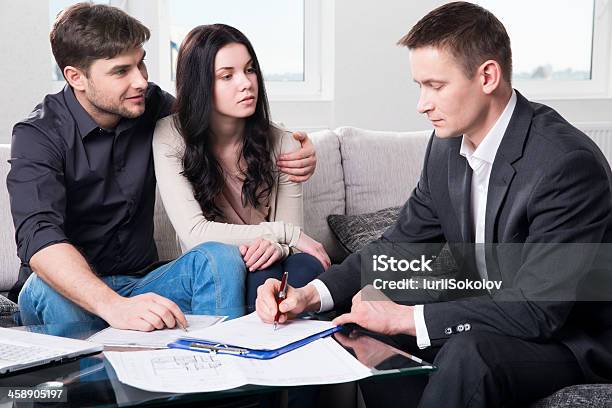 Agent Advises The Couple Signing Documents Stock Photo - Download Image Now - Adult, Advice, Agreement